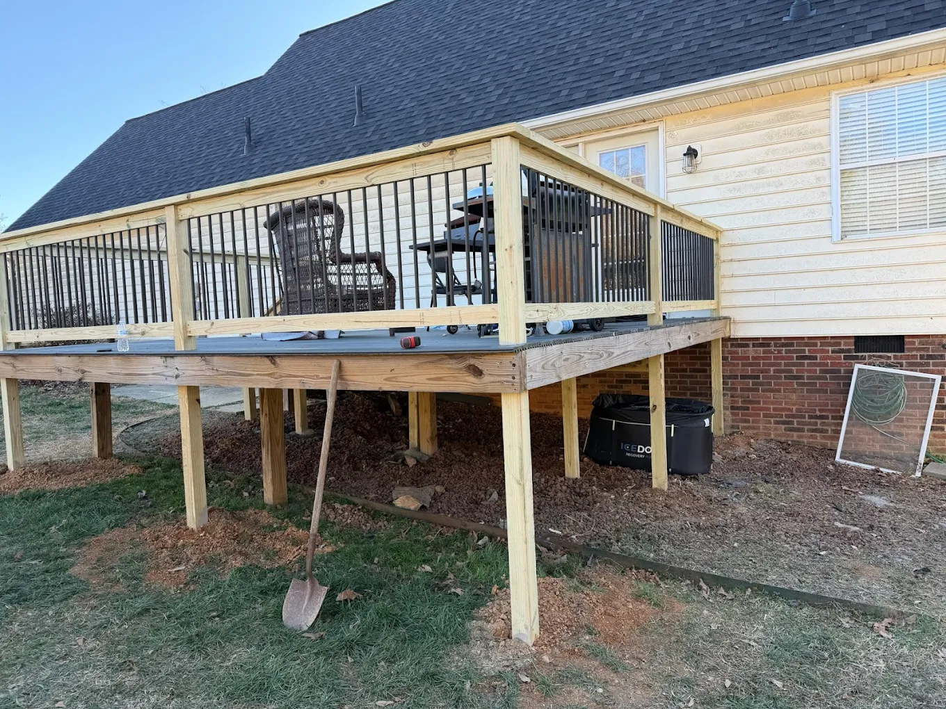 Custom elevated wood deck with metal balusters